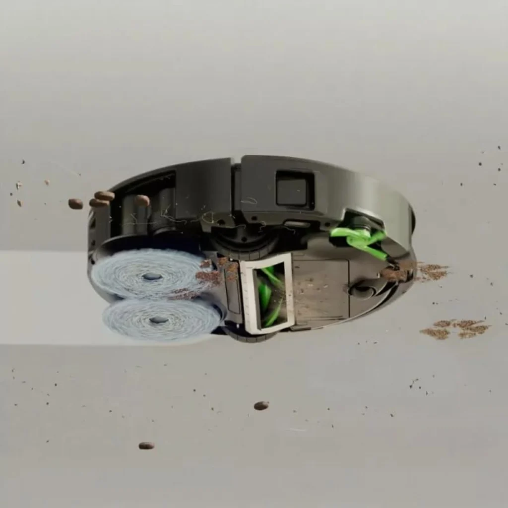 Le Roomba Plus 576 aspire des débris et lave le sol