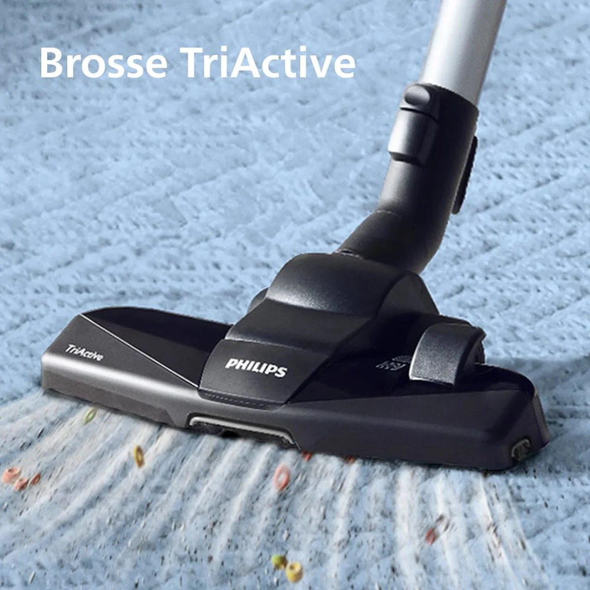 La brosse TriActive du Philips PowerPro Compact sur un tapis